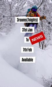 a person is skiing down a snow covered slope at A short walk to Akakura Onsen Ski Lift and Town by Japow House in Myoko