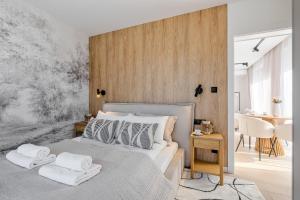 Ένα ή περισσότερα κρεβάτια σε δωμάτιο στο Odkryj-Bialke Apartamenty Małe Białczańskie