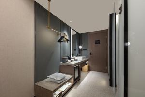 a bathroom with a sink and a mirror at Atour S Hotel Beijing International Trade CBD Jianguo Men in Beijing