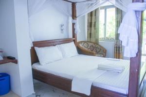 Ένα ή περισσότερα κρεβάτια σε δωμάτιο στο Manyatta Hotels & Apartments +49 φωτογραφίες