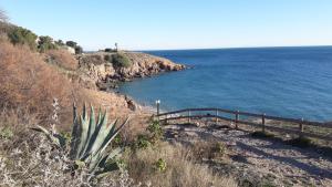 a view of the ocean from a hill with a fence at Terramer – Séjour face à la mer, Wifi, plage, piscine et commerces à pied - Corniche in Sète