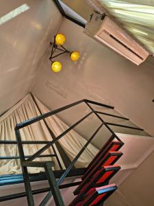 a bunk bed in a room with two lights at Rustic Palms in Thāl