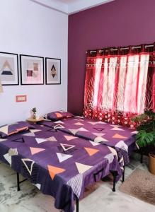 Ένα ή περισσότερα κρεβάτια σε δωμάτιο στο Grace Garden