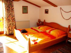 a bedroom with a large bed in a room at Haus König Fewo in Türnitz