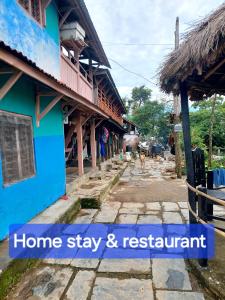 a building with a sign that reads home stay and restaurant at Culture home, home stay in Bandīpur