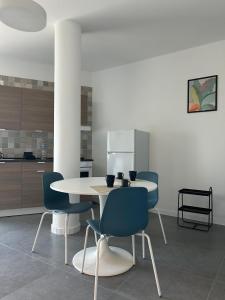 a dining room with a table and chairs at Relax Apartment in San Salvo