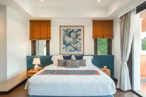 Ένα ή περισσότερα κρεβάτια σε δωμάτιο στο Laguna Village 4-BR Pool Villa by Stayisle +87 φωτογραφίες