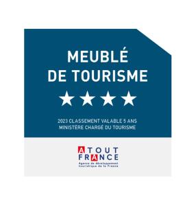 a sign that reads mobile de touinement with stars at L'ariot 1984 - appartement cosy avec terrasse, parking et wifi in Sète