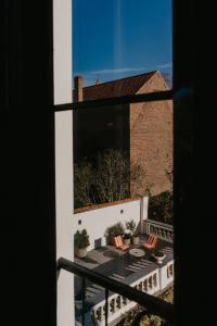 a view of a balcony from a window at Isidore in Bruges