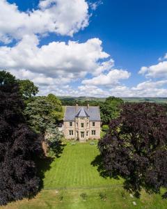 an aerial view of a large house on a lawn at Stow House in Aysgarth