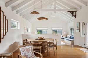 a dining room with a table and chairs at Saltwood Walk to Yallingup Lagoon in Yallingup