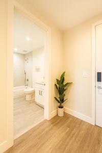a bathroom with a toilet and a sink at Luxe & cozy 3Beds,2rooms,EV Gym Near Beaches&Downtown WPB in West Palm Beach +32 photos