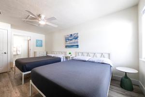 Voodi või voodid majutusasutuse Sunny Shores Retreat 6 toas +37 fotot