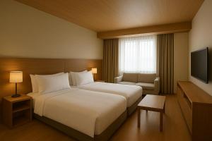 a hotel room with a bed and a television at Busan Seomyeon Nestly Hotel in Busan