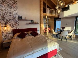 a bedroom with a bed and a dining room at Bükk Hill Garden in Miskolc