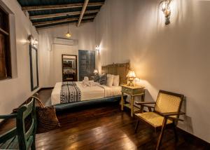 Giường trong phòng chung tại Galle Manor Boutique Villa