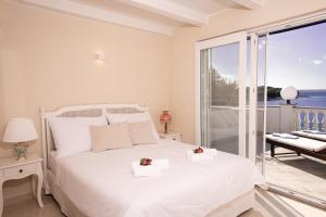 Ένα ή περισσότερα κρεβάτια σε δωμάτιο στο La Villa-Silba