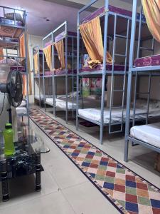 Ένα ή περισσότερα κρεβάτια σε δωμάτιο στο Luxe Sleep Dormitory