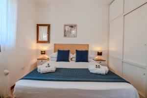 Postel nebo postele na pokoji v ubytování Villetta con Giardino a pochi passi dalla Spiaggia + 50 fotografií