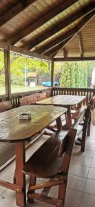 a group of tables and chairs in a building at Cabana 23 - Avrig in Avrig +10 photos