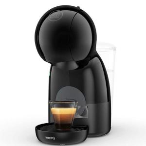 a black coffee maker with a glass of coffee at Apartamento Luminoso em Miranda in Miranda do Douro