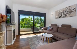 a living room with a couch and a table at Villa Angello in Matulji