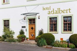 a hotel adelbert building with a wooden door at Adalbert Ecohotel in Prague