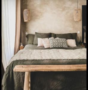 a bedroom with a large bed with a wooden frame at Lahima Cabanas in Dickwella