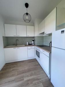 Køkken eller tekøkken på À deux pas du centre ville