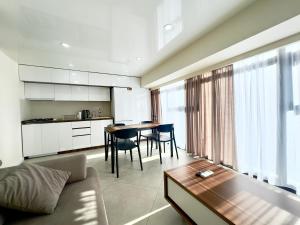 a living room with a couch and a table at GSS - A Apartment in Tbilisi City