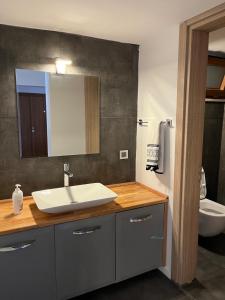 a bathroom with a sink and a mirror at Detached 800 square meter villa with forest view in the city in Pamukkale