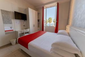 Postel nebo postele na pokoji v ubytování Hotel Lido