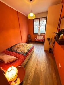 a bedroom with a bed and a table and a window at WhiteHome in Conegliano +41 photos