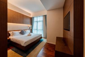 Postel nebo postele na pokoji v ubytování Tribeca Homestay Bukit Bintang TRX