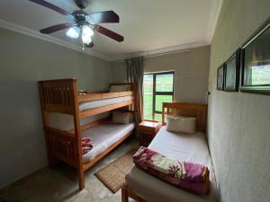 Postel nebo postele na pokoji v ubytování Silver Mist Resort, Haenertsburg