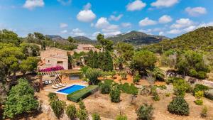 an aerial view of a house with a swimming pool at Can Pessal in Es Carritxo