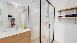 a bathroom with a shower and a sink at Casa 3 Merlyne Plage in Saint-Gilles-Croix-de-Vie +23 photos