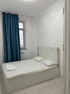 Voodi või voodid majutusasutuse Абди-Хан toas