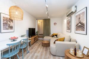 a living room with a couch and a table at Villa LaPetra in Cavtat