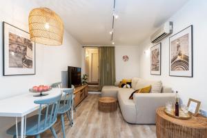 a living room with a couch and a table at Villa LaPetra in Cavtat