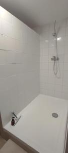 a white bathroom with a shower and a sink at Le Laoul cottage 2 people in Bourg-Saint-Andéol