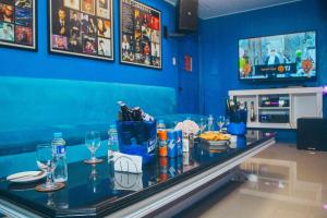 a bar in a restaurant with food and drinks at The Stackey Hotel in Olongapo +5 photos