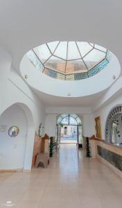 a large room with a ceiling with a skylight at yasmina hotel in Dahab