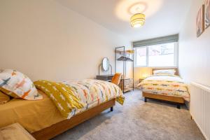 Giường trong phòng chung tại Battersea Boutique Apartments