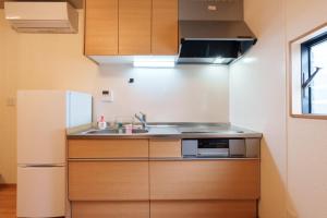 Кухня или мини-кухня в Tenjin Bridge Guestroon Maximum 10 people
