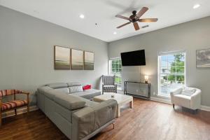 a living room with a couch and a ceiling fan at New Listing Bulldog Borough in Downtown Athens in Athens