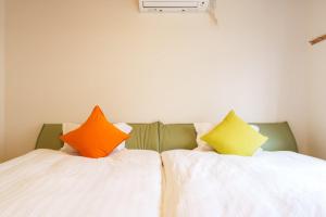 Кровать или кровати в номере Tenjin Bridge Guestroon Maximum 10 people