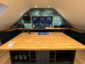 a kitchen with a wooden counter top in a room at The Silvan Lodge, Peace, Privacy, and Pure calm 