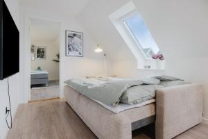 Ένα ή περισσότερα κρεβάτια σε δωμάτιο στο Exclusive 2BR apartment with a focus on comfort