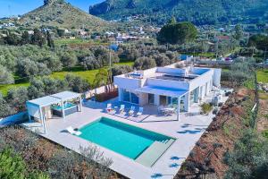 an aerial view of a house with a swimming pool at Villa the Twins in Castellammare del Golfo
